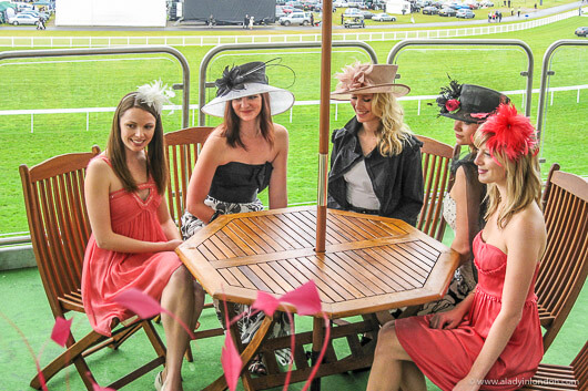Models posing during a photo shoot at Royal Ascot