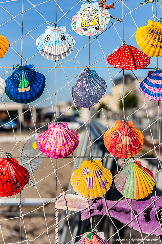 Painted Seashells on a Fence