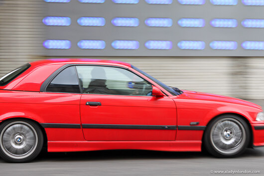 Panning Shot of a Red Car in London
