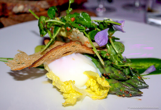 Asparagus with Bacon, Croutons, and Egg at a Dinner at The Cuckoo Club in London, England