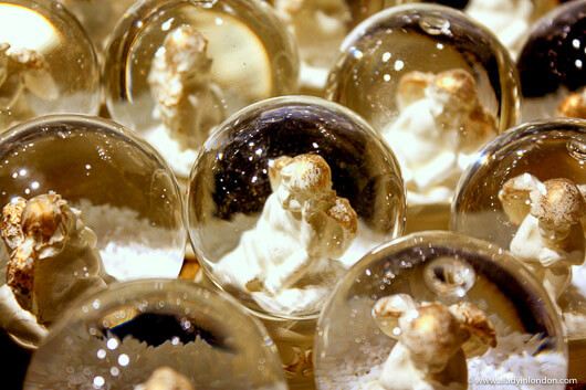 Snow globes with angels at the Salzburg Cathedral Christmas market in Austria