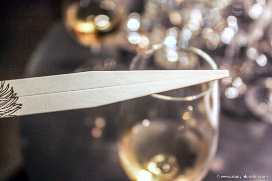 Perfume stick and wine glass at a wine and perfume pairing in London