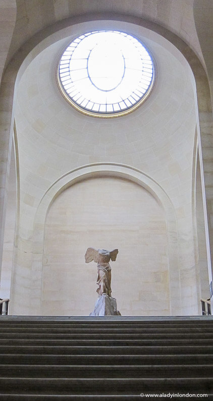 Winged Victory of Samothrace in an empty hall on a Louvre after-hours tour in Paris