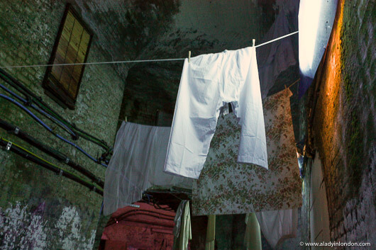 Clothes hanging from the ceiling at Secret Cinema in London