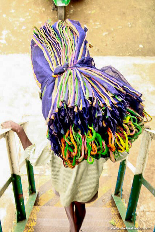 Worker carrying bags at a Sri Lankan tea factory near Hatton