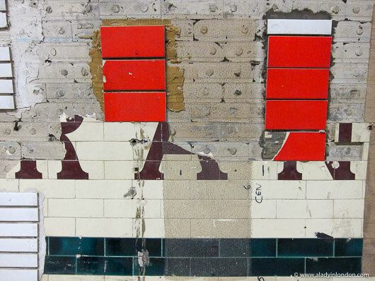 Testing tiles in the disused Aldwych tube station in London