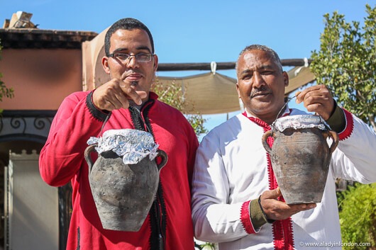Men Holding Tangias with Camel in Marrakech