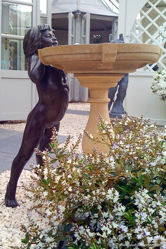 Fountain with a child at the Chelsea Flower Show in London