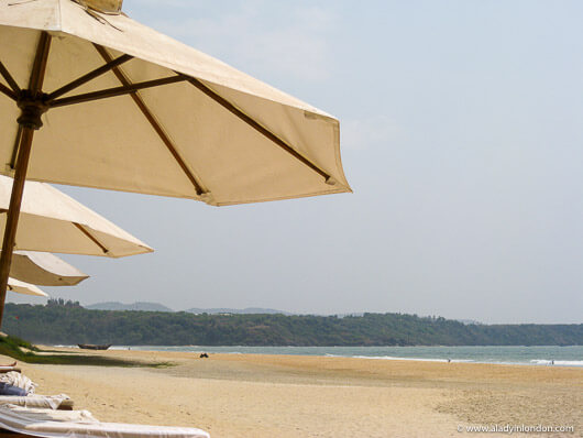 Umbrellas on the beach in Goa at the Leela in India