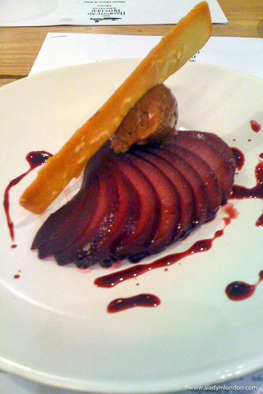 Poached pear in red wine sauce with chocolate mousse