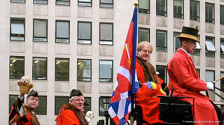 People waving from a carriage at the Lord Mayor's Show in London