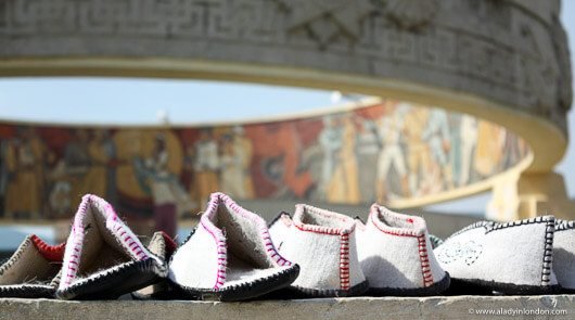 Traditional shoes in front of a Soviet war monument in Ulaanbaatar, Mongolia