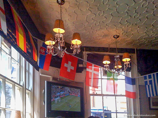 Flags in the King William IV pub in London during the World Cup