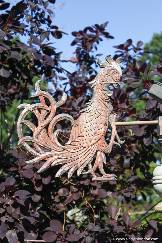Metal rooster sign at an antiques shop in La Conner, Washington