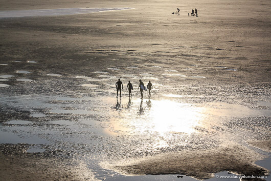 Surfers on the beach in Cornwall