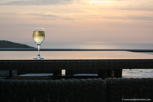 Glass of wine at sunset in Cornwall, UK