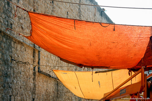 Sheets hanging over a street in the old town in Dubrovnik, Croatia