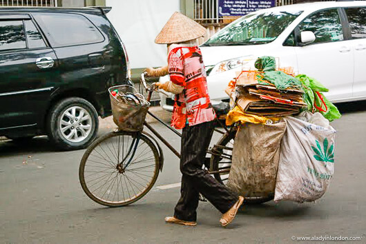 Woman with a bicycle in Ho Chi Minh City, Vietnam