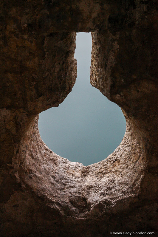 Keyhole view in the city wall in Kotor