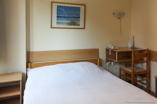 Bed in a room in Hotel 7 in Skopje, North Macedonia