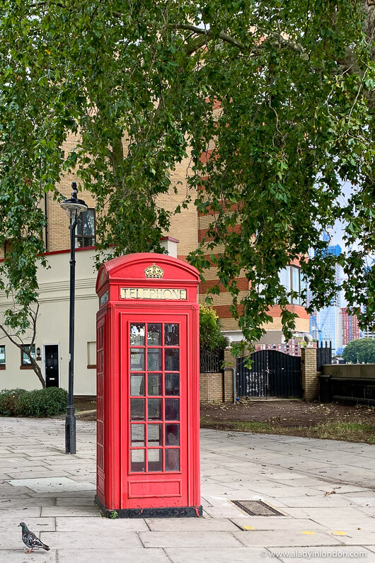 Red Phone Box by the Thames in Pimlico, London